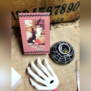 NWT lot of 2 Halloween decorations ceramic skeleton hand that holds a bow